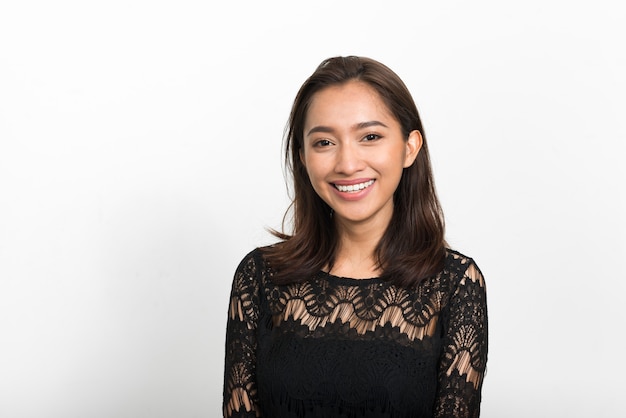 Studio shot of young beautiful Asian woman