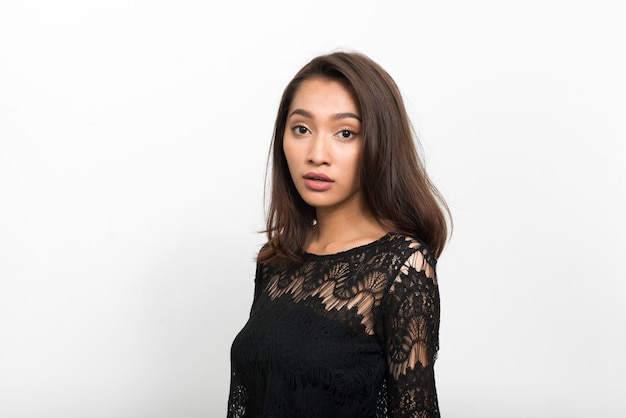 Studio shot of young beautiful Asian woman