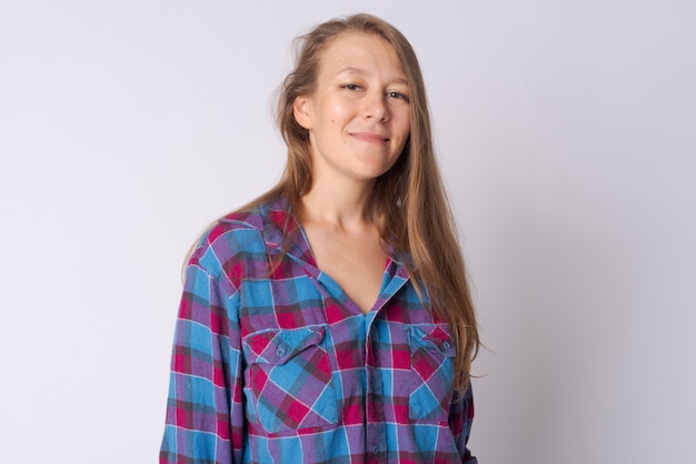 Studio shot of young beautiful hipster woman against white