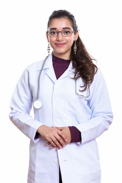 Studio shot of young beautiful Indian woman doctor