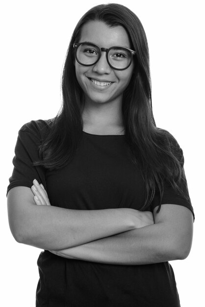 Studio shot of young beautiful woman isolated against white background in black and white