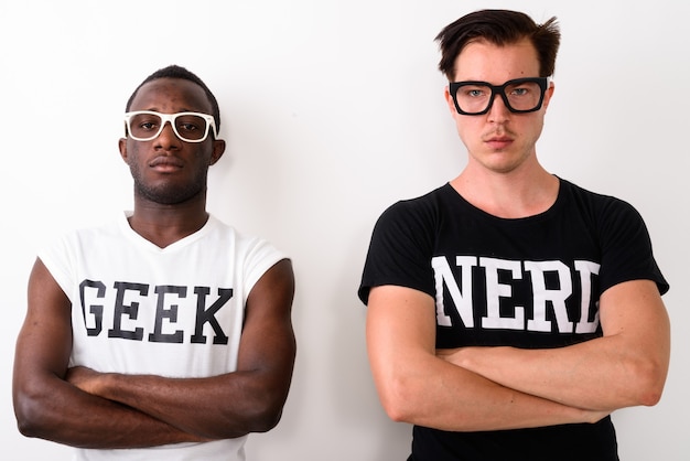 Studio shot of young black African Geek man with European Nerd m