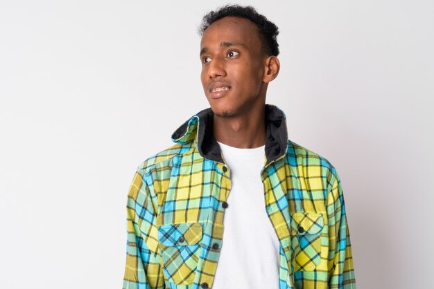 Studio shot of young handsome African hipster man with Afro hair against white