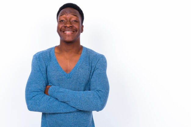 Studio shot of young handsome African man against white background