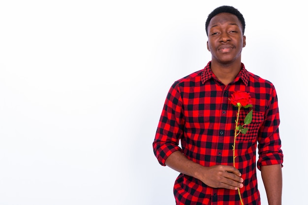 Studio shot of young handsome African man against white background