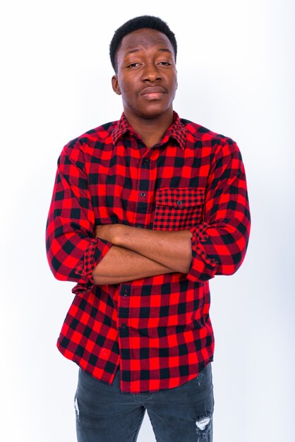 Studio shot of young handsome African man against white background