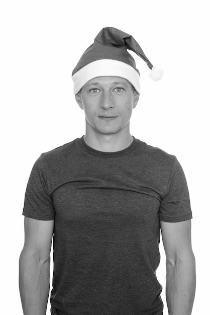 Studio shot of young handsome man ready for Christmas isolated, black and white