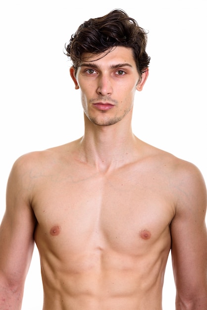 Studio shot of young handsome man shirtless