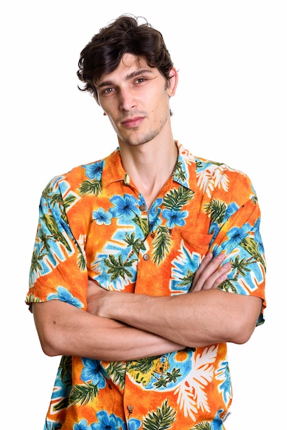 Studio shot of young handsome man with arms crossed