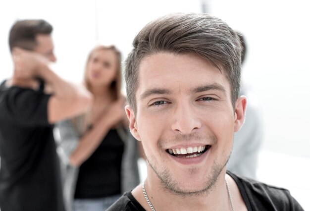 Studio shot of young man looking at the camera Isolated on the office background Horizontal format