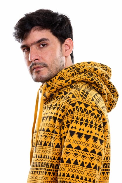 Studio shot of young Persian man hoodie