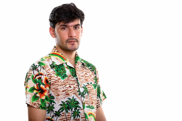 Studio shot of young Persian man wearing Hawaiian shirt