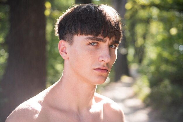 Studio shot of young sexy man looking at the camera. Handsome guy with confident face. Male beauty concept.