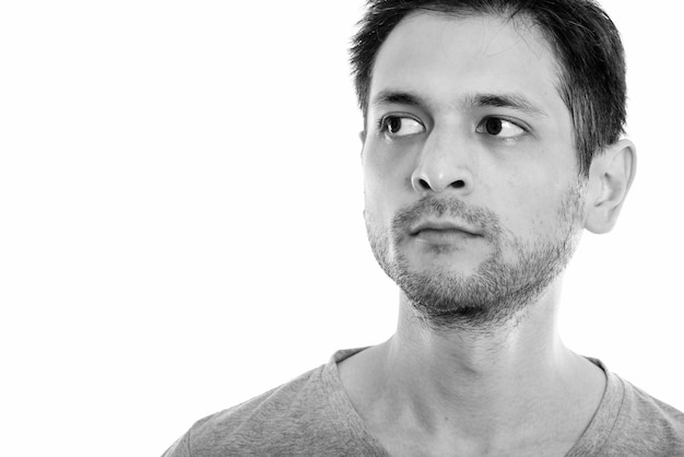 Studio shot of young skinny man isolated, black and white