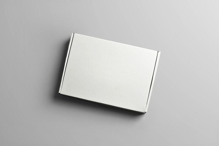 Photo studio template of carton box for clothes . closed blank cardboard box with  shadows of the gray background. mockup  can use for you showcase.