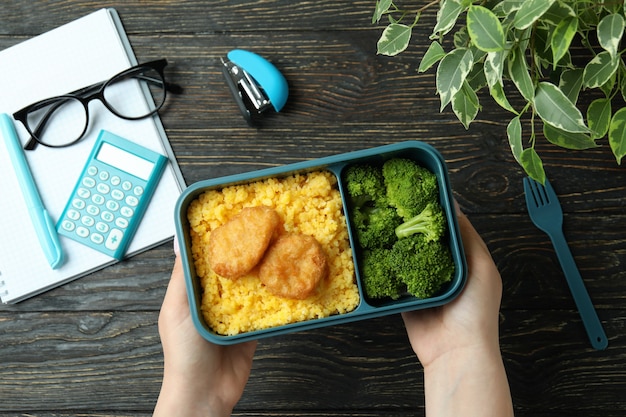 Study concept with lunch box on wooden table