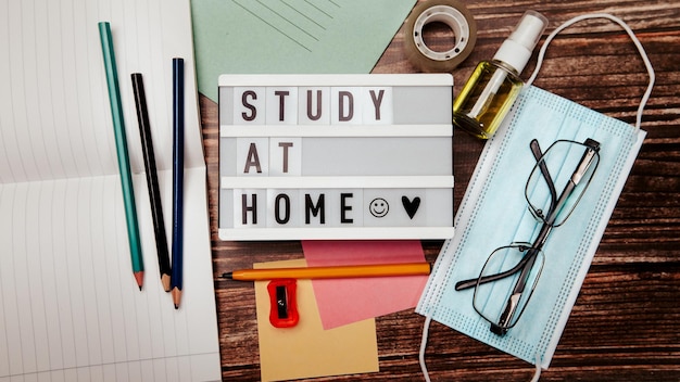 Study at home inscription on the desk