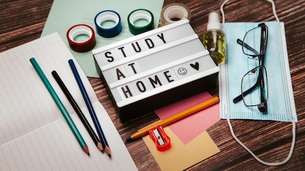 Study at home inscription on the desk