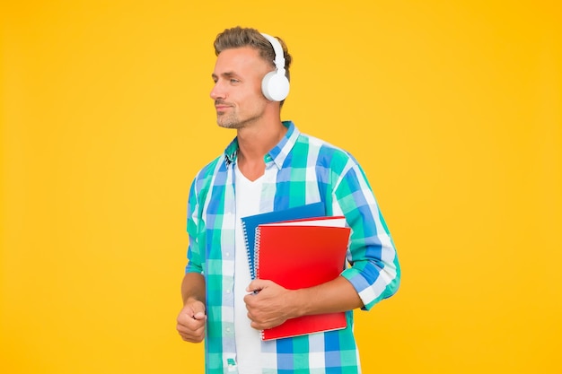 Study languages Free courses Audio courses Learning english Modern technology Audio book concept Worldwide knowledge access Audio library Man handsome student wear headphones hold books