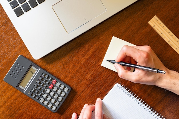 Studying mathematics and taking notes at a desk