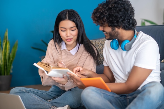 Photo studying together. young people studying together and looking involved