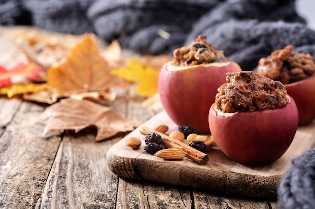 Stuffed apples baked with nuts on a wooden table