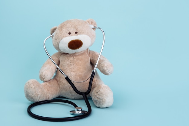 Stuffed Bear animal presented as a pediatrician holding a stethoscope