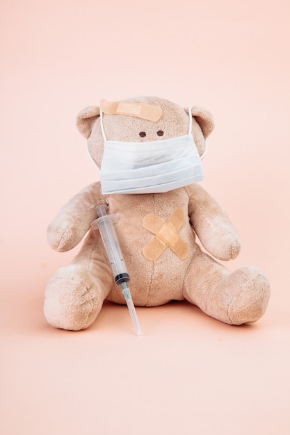 Stuffed Bear with a mask and syringe