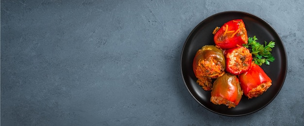 Stuffed bell pepper on a dark background Top view copy space