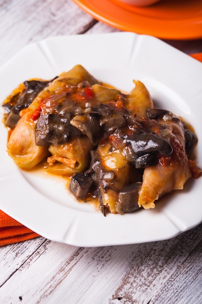 Stuffed cabbage with mushroom sauce on a plate