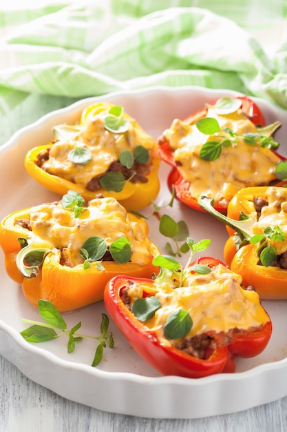 Stuffed colorful peppers with meat cheese vegetables