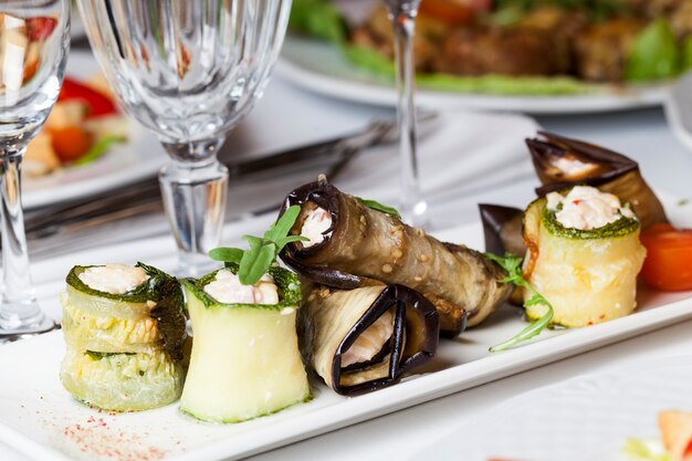 Stuffed eggplant on a banquet table, close-up of eggplant, zucchini and other vegetables