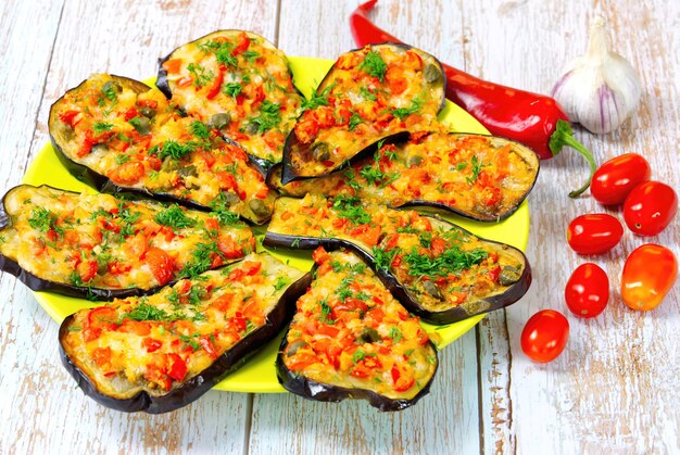 Stuffed eggplant snacks with tomato garlic and cheese