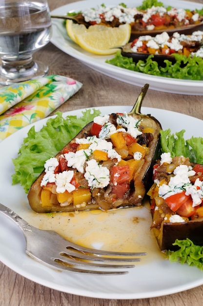 Stuffed eggplant with ricotta and vegetables in lettuce