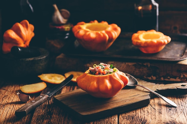 Stuffed pattypan squash on rustic cutting board