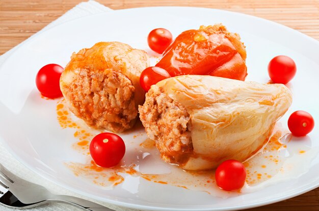 Stuffed peppers on a plate isolated on white