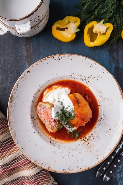 Stuffed peppers with meat on a plate Top view