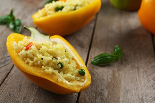 Stuffed peppers with vegetables on table close up