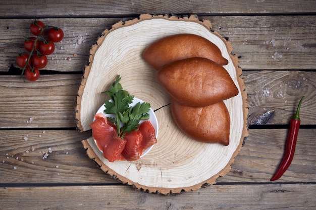 Stuffed pies on wood plaate