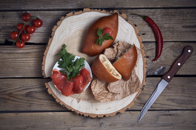 Stuffed pies on wood plaate