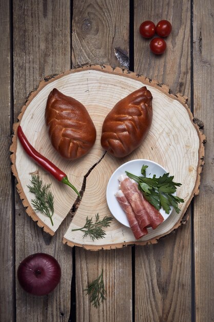 Stuffed pies on wood plaate