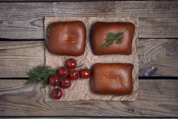 Stuffed pies on wood plaate