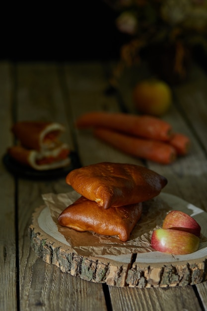 Photo stuffed pies on wood plaate