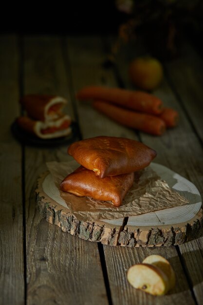 Photo stuffed pies on wood plaate