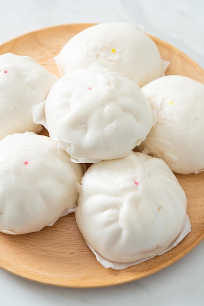 stuffed steamed bun on wood plate - Chinese food style