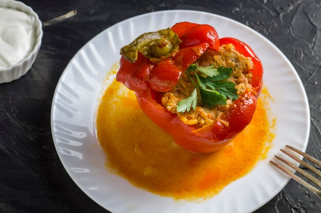 Stuffed sweet bell pepper in a plate close-up