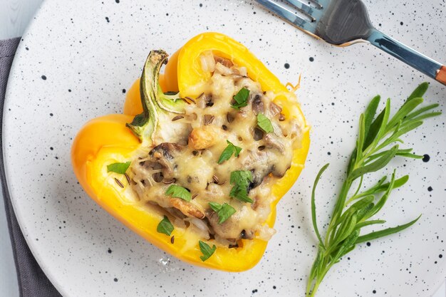 Stuffed sweet pepper with rice mushrooms and cheese