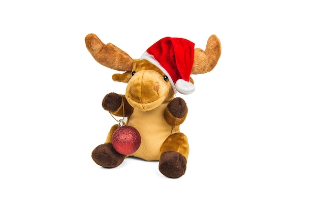 Stuffed toy Christmas deer in Santa Claus hat isolated on white wall