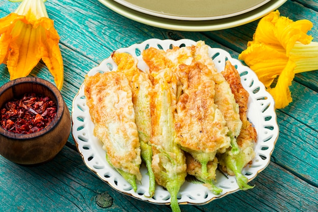 Stuffed zucchini flower on plate