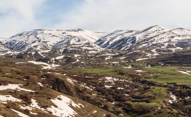 Stunning mountain landscape Snowcovered mountains and green valleys Zangezur Mountains Armenia